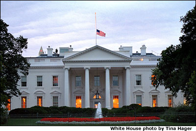 The American flag flies at half-staff at the White House as dawn's early light rises over the nation's capitol Sept. 14.